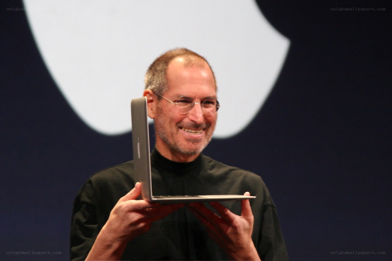 Steve Jobs presenting a laptop