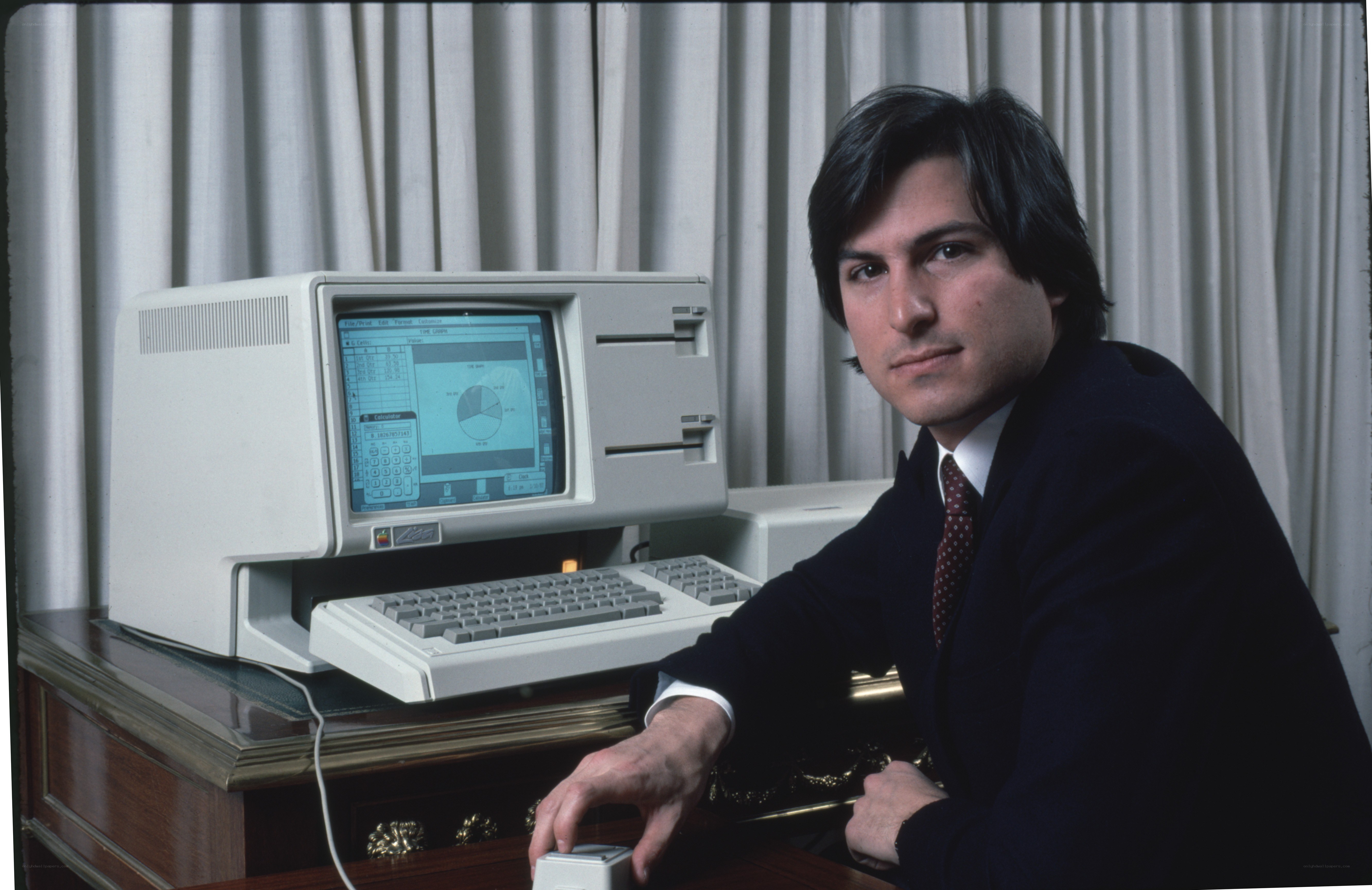 Steve Jobs with early Macintosh