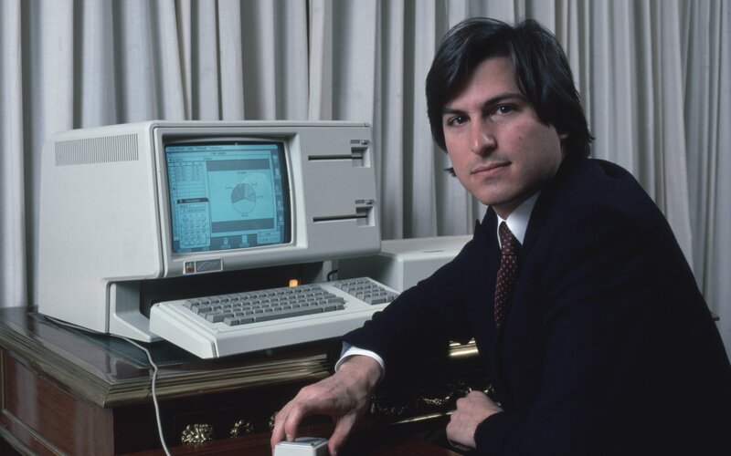 Steve Jobs with early Macintosh