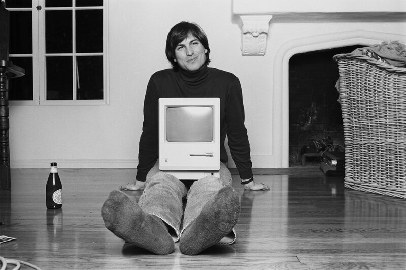 Steve Jobs with early Macintosh