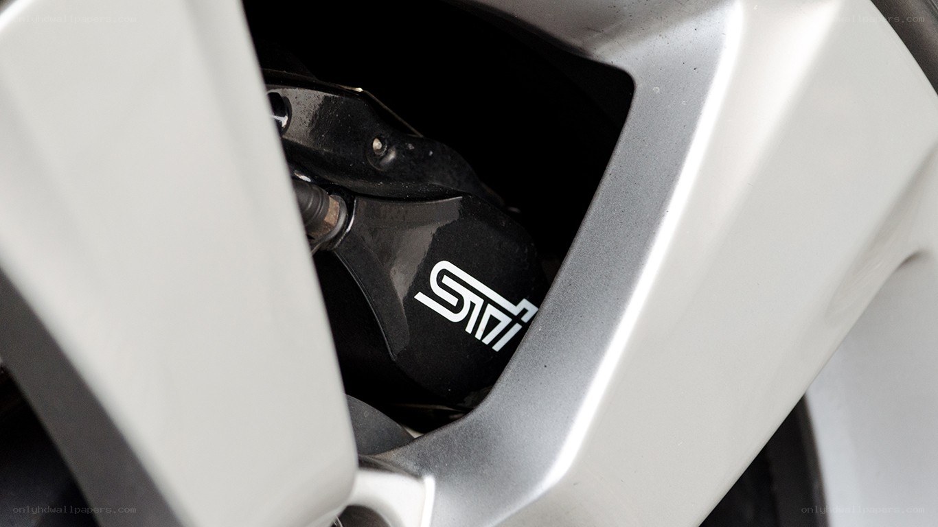 STI brake caliper on car