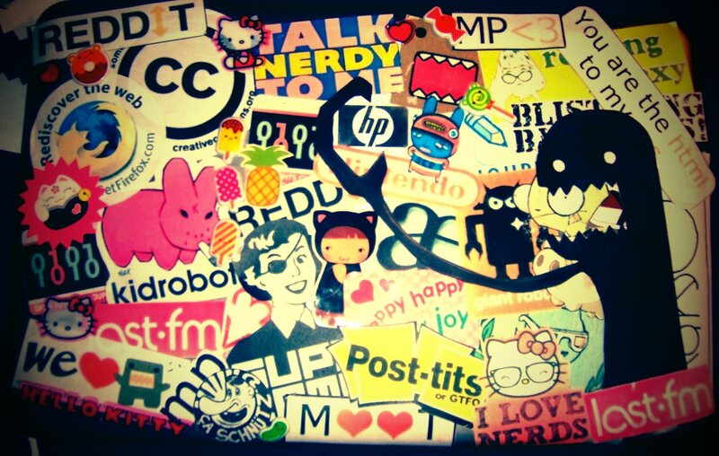 sticker-covered surface with cartoon characters