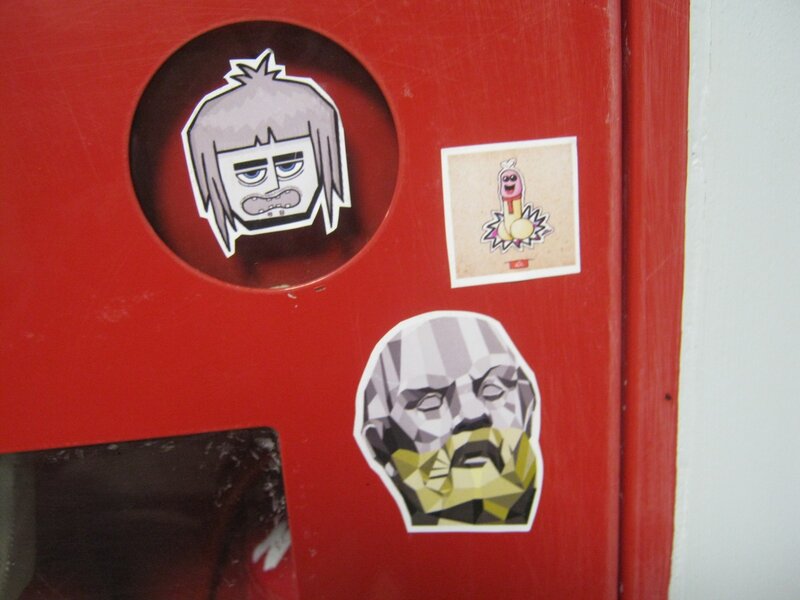 stickers on a red surface