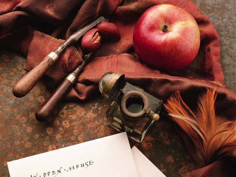 Still life with apple and quill