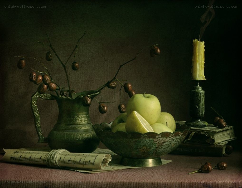 Still life with apples and candle