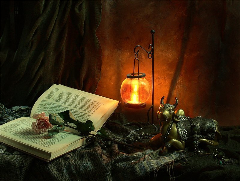 Still life with book and lantern