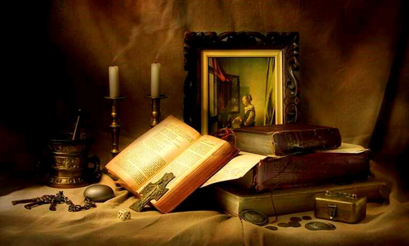 Still life with books and candlelight