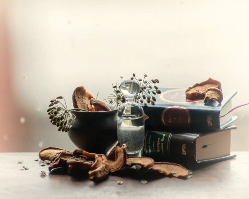 Still life with books and perfume