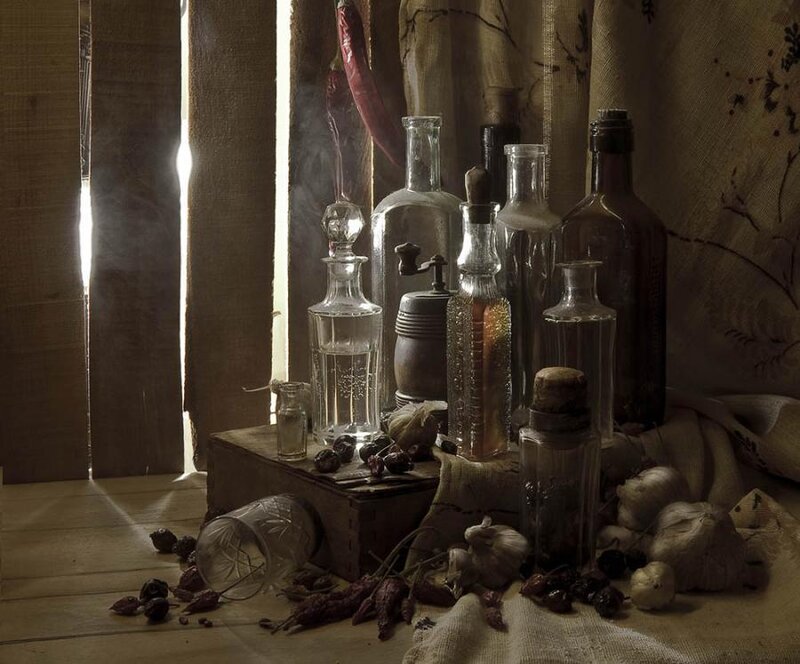 Still life with bottles and herbs