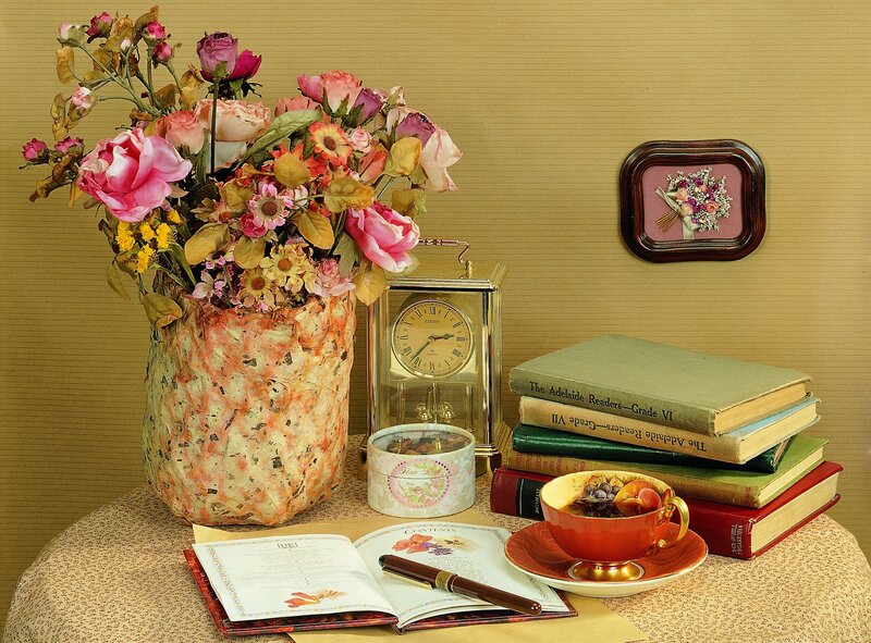 Still life with flowers and books