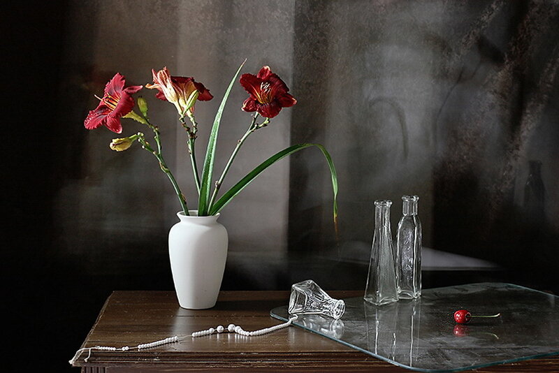 Still life with flowers and glass