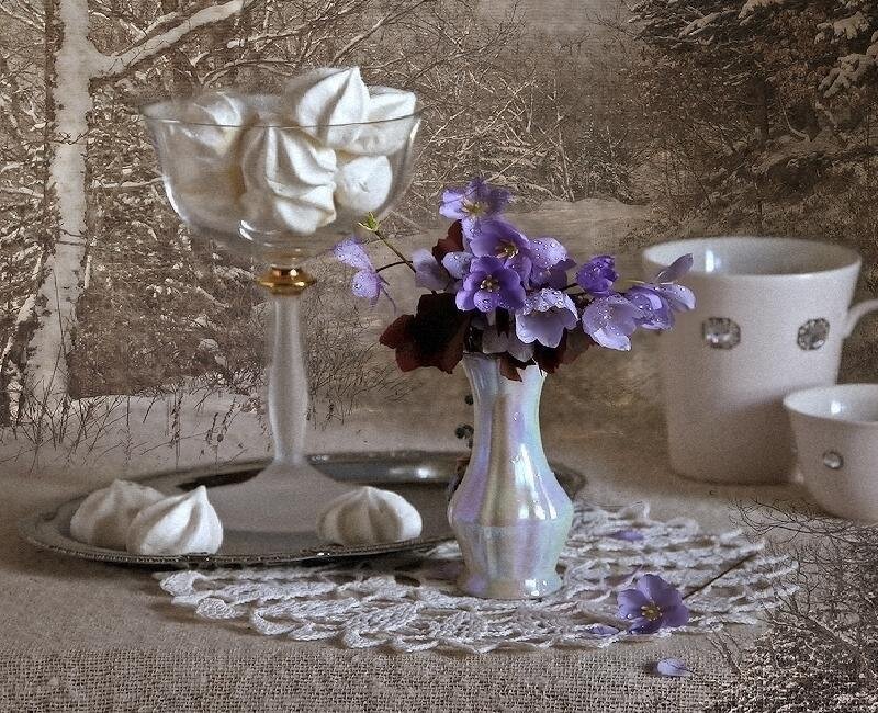 Still life with flowers and meringues