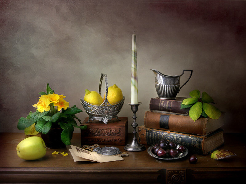 Still life with fruit and books
