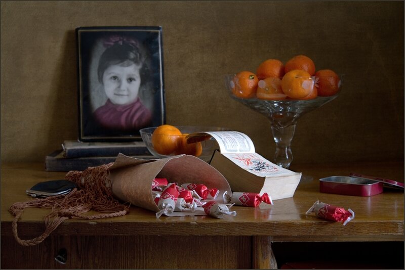 Still life with photo and oranges
