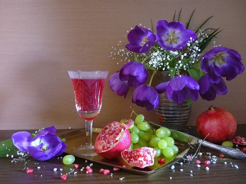 Still life with pomegranate and flowers