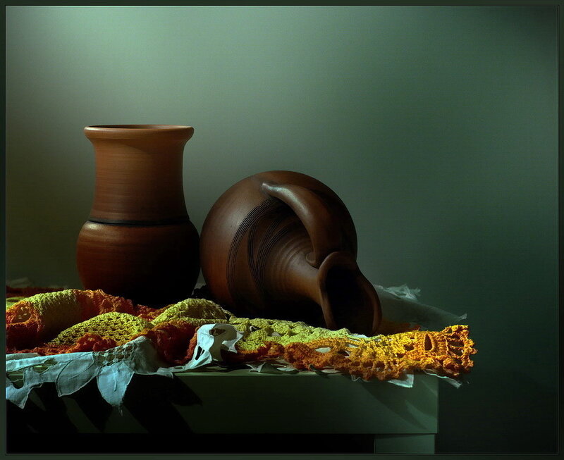 Still life with pottery and crocheted cloth