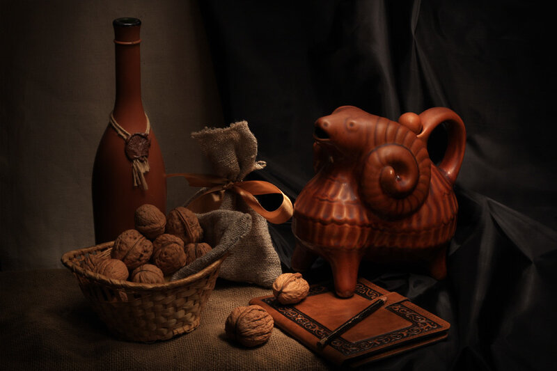 Still life with pottery and walnuts