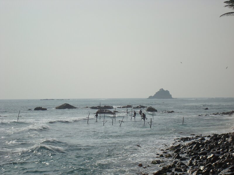Stilt fishermen at sea