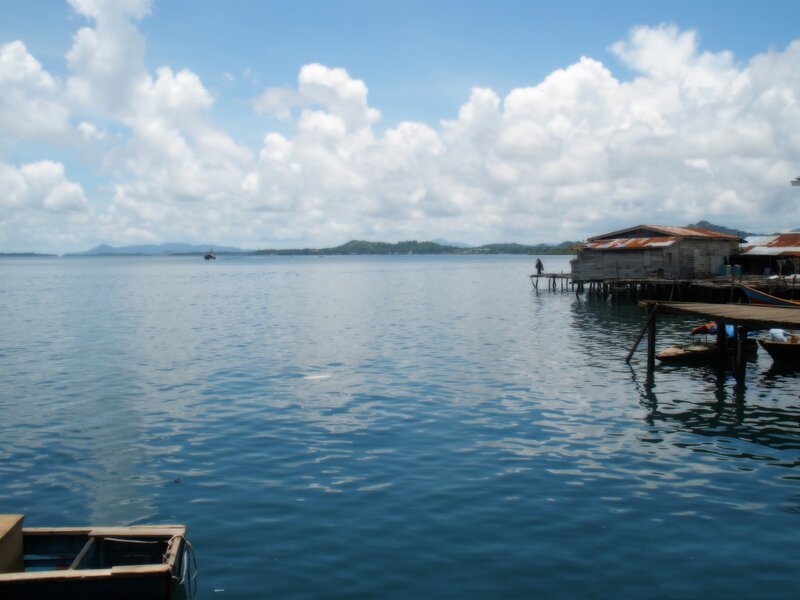 Stilt houses on a calm bay