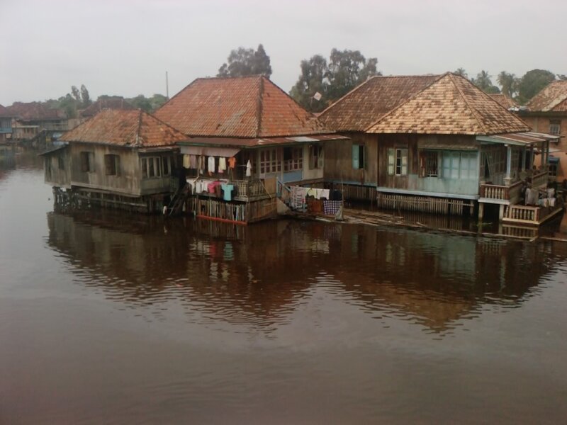 Stilt Houses on Water — Brown