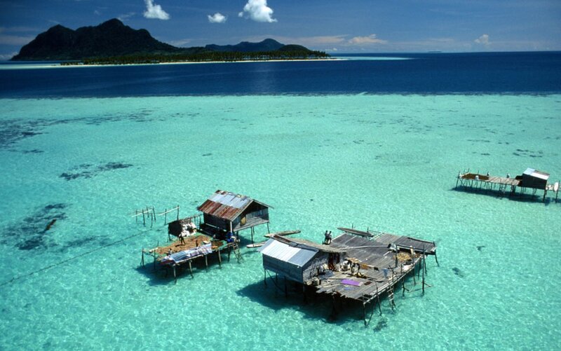 Stilt houses over turquoise water