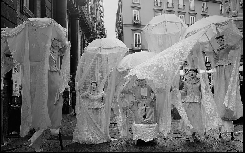 Stilt Performers in White