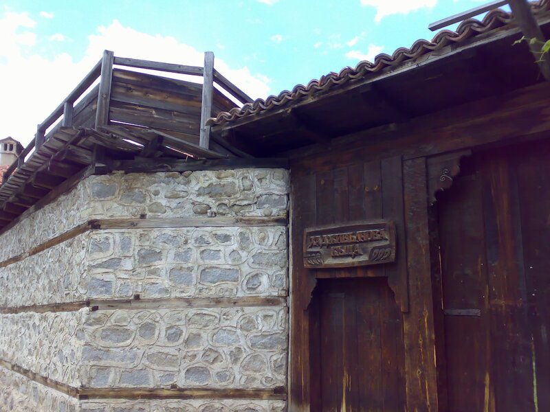 Stone and wood house with balcony