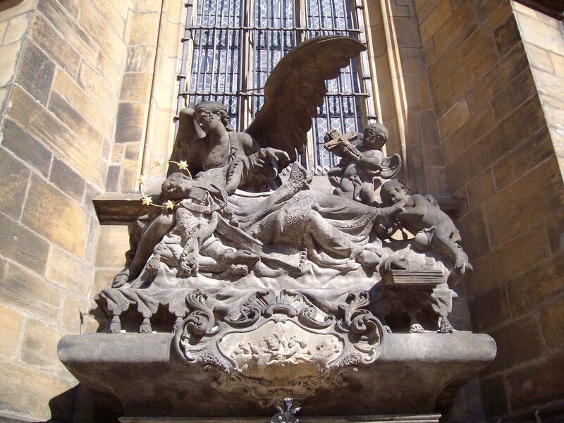 stone angel sculpture on church