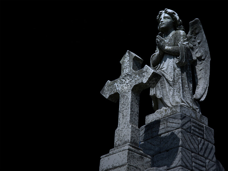 stone angel statue at night