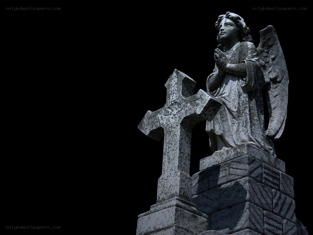 stone angel statue at night