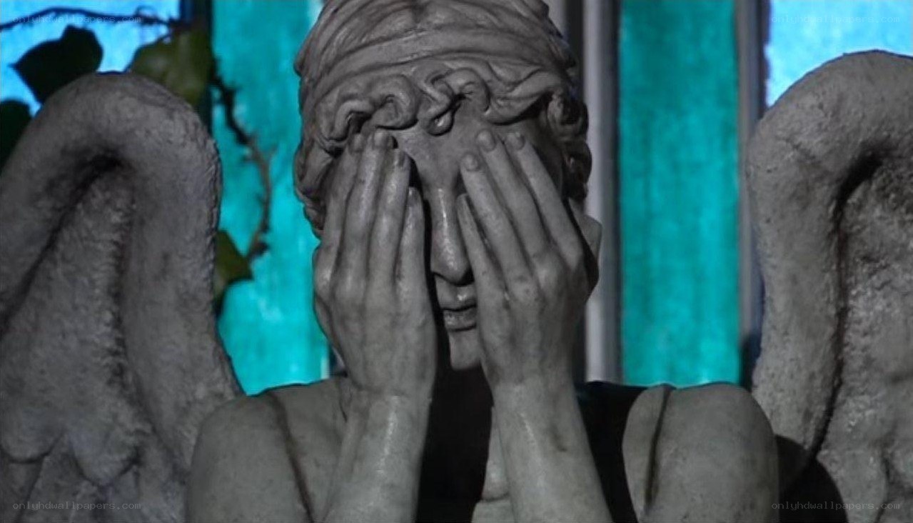 stone angel statue covering face