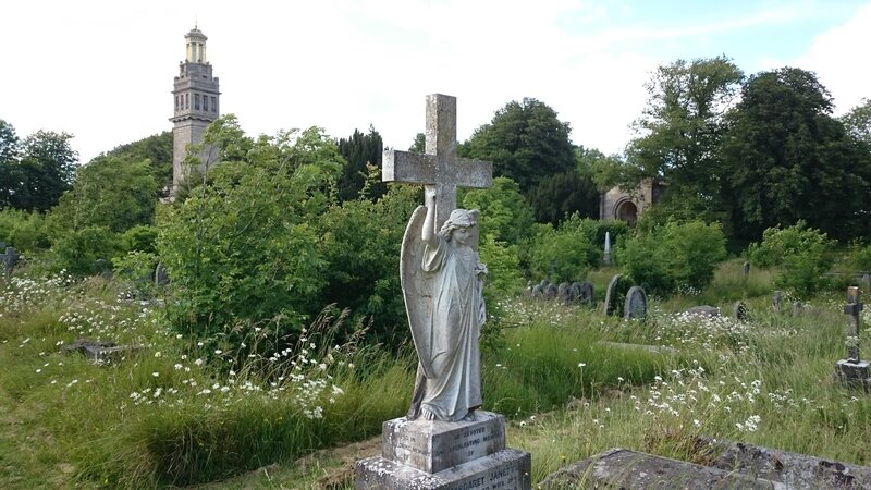 Stone Angel Statue — Green, Serene, Afternoon