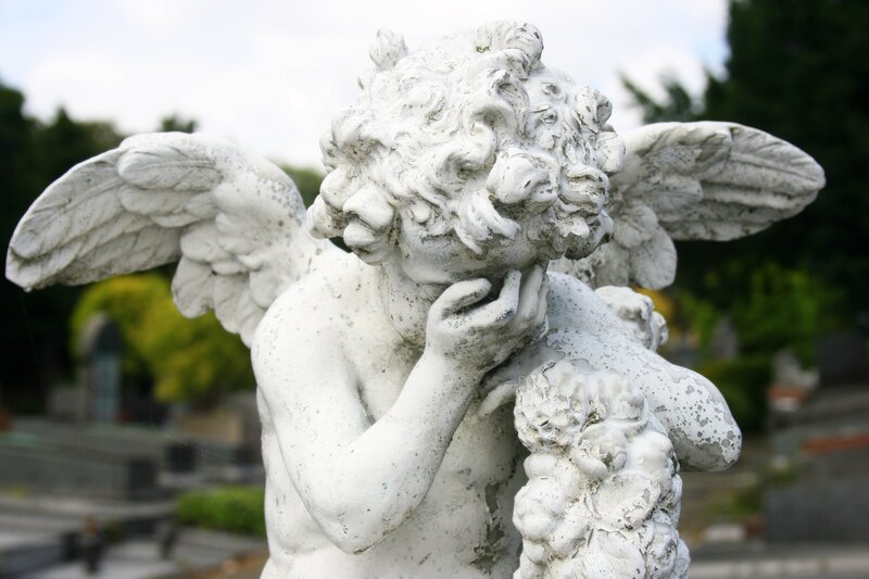 stone angel statue in cemetery