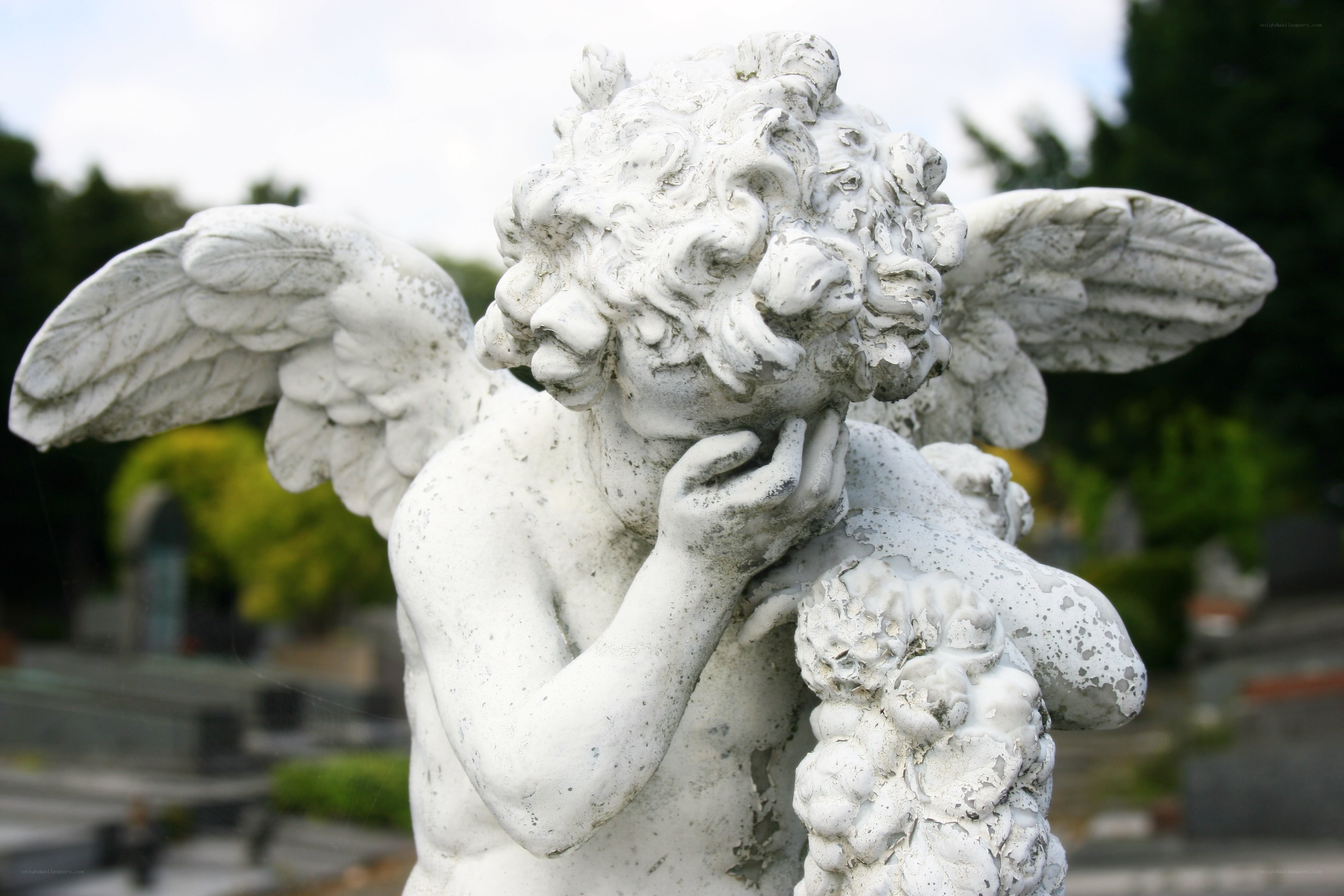 stone angel statue in cemetery