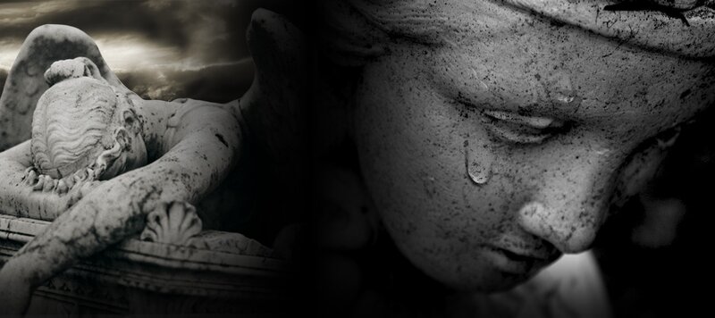 stone angel statue in mourning