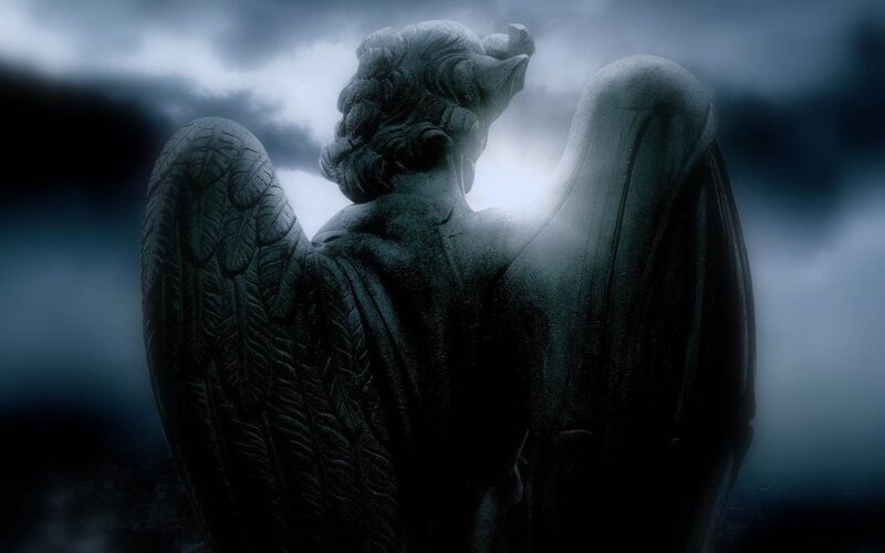 stone angel statue in storm