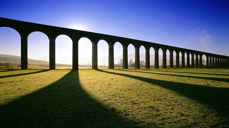 Stone arch bridge at sunrise