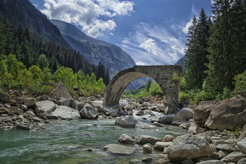 Stone Arch Bridge — Blue, Serene, Afternoon, Photograph, River, Mountain, Trees