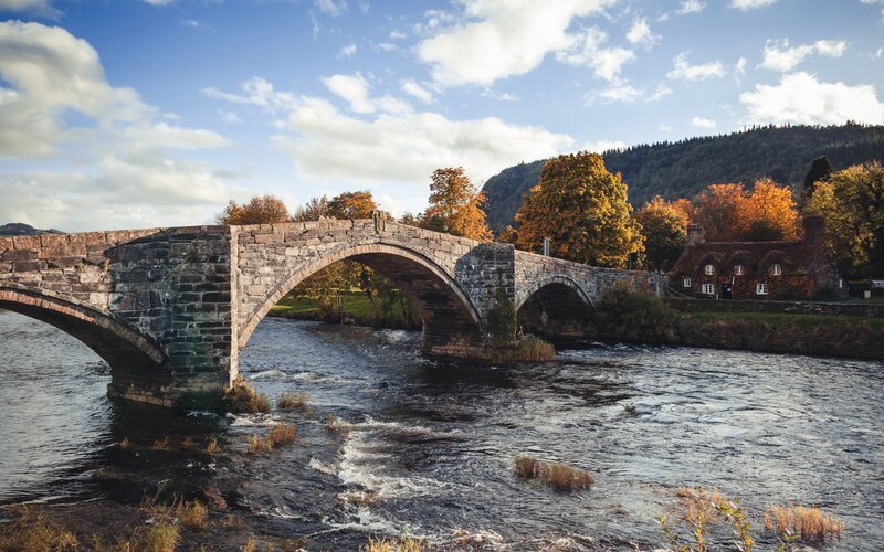 Stone Arch Bridge — Blue, Serene, Autumn, Photograph, River, Trees
