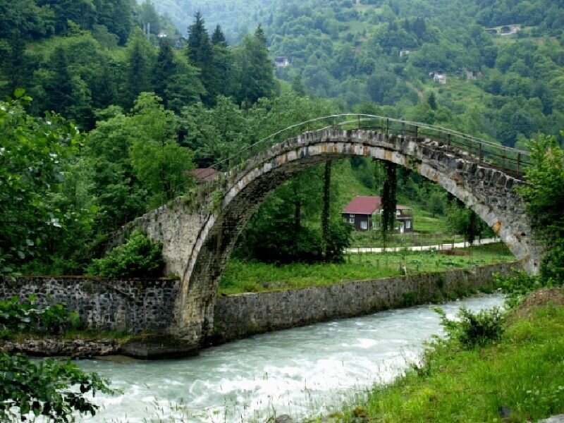 Stone Arch Bridge — Green, Serene, Afternoon, Photograph, River, Forest, House