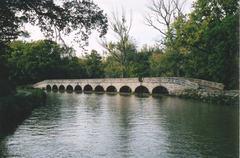 Stone Arch Bridge — Green, Serene, Afternoon, Photograph, River, Trees, Arches