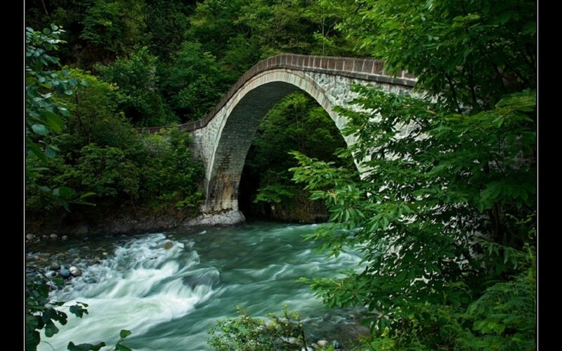 Stone Arch Bridge — Green, Serene, Afternoon, Photograph, River, Trees, Forest, Gray