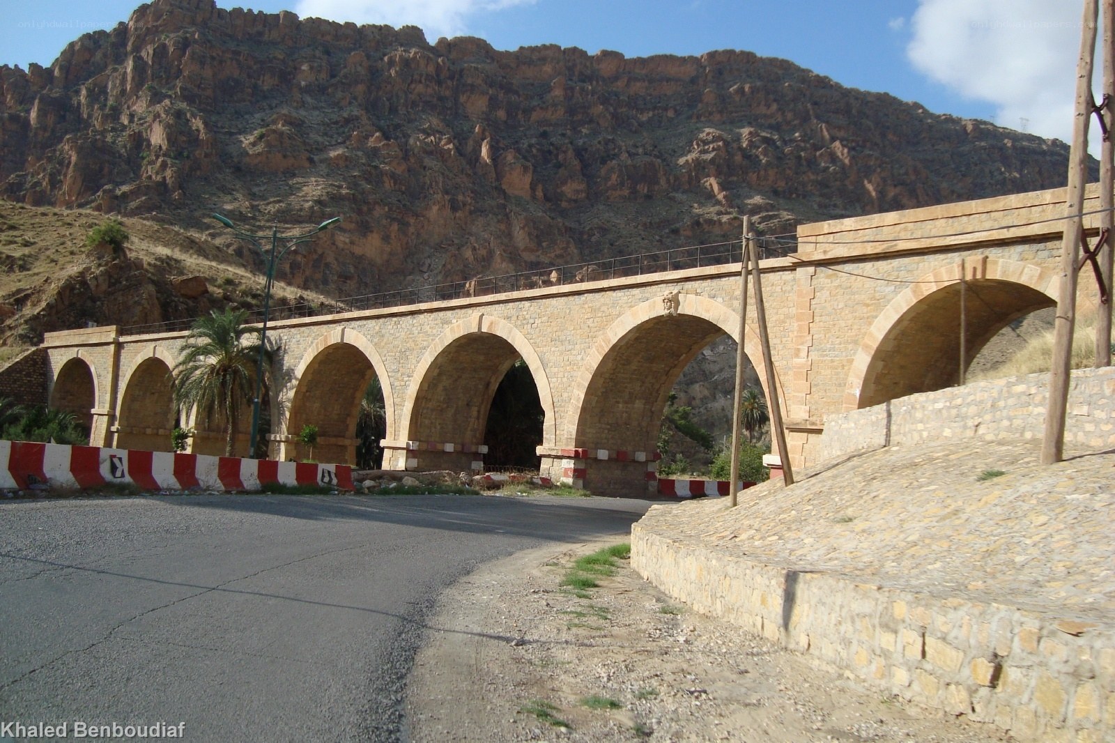 Stone arch bridge in mountainous region