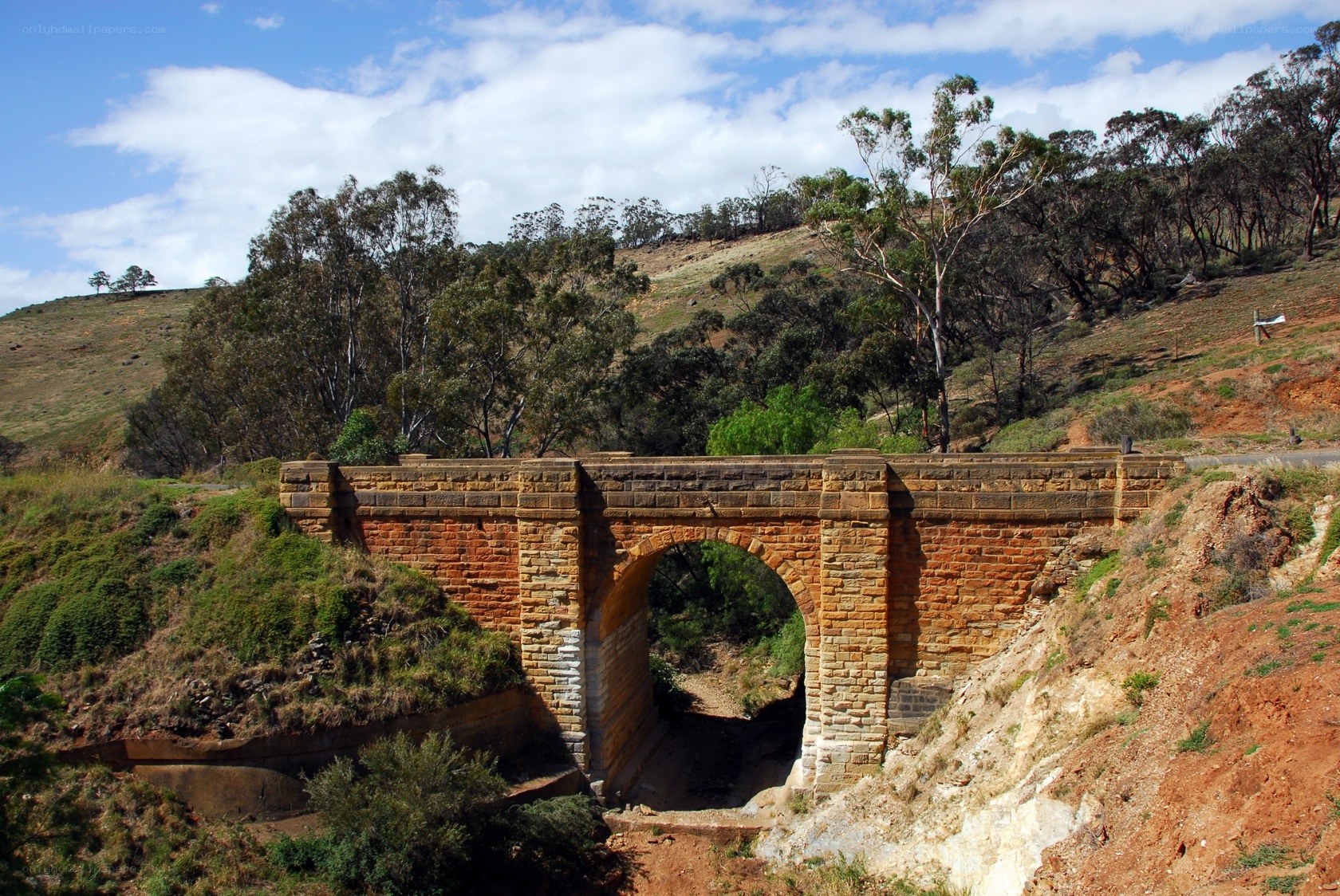 Stone arch bridge in rural landscape