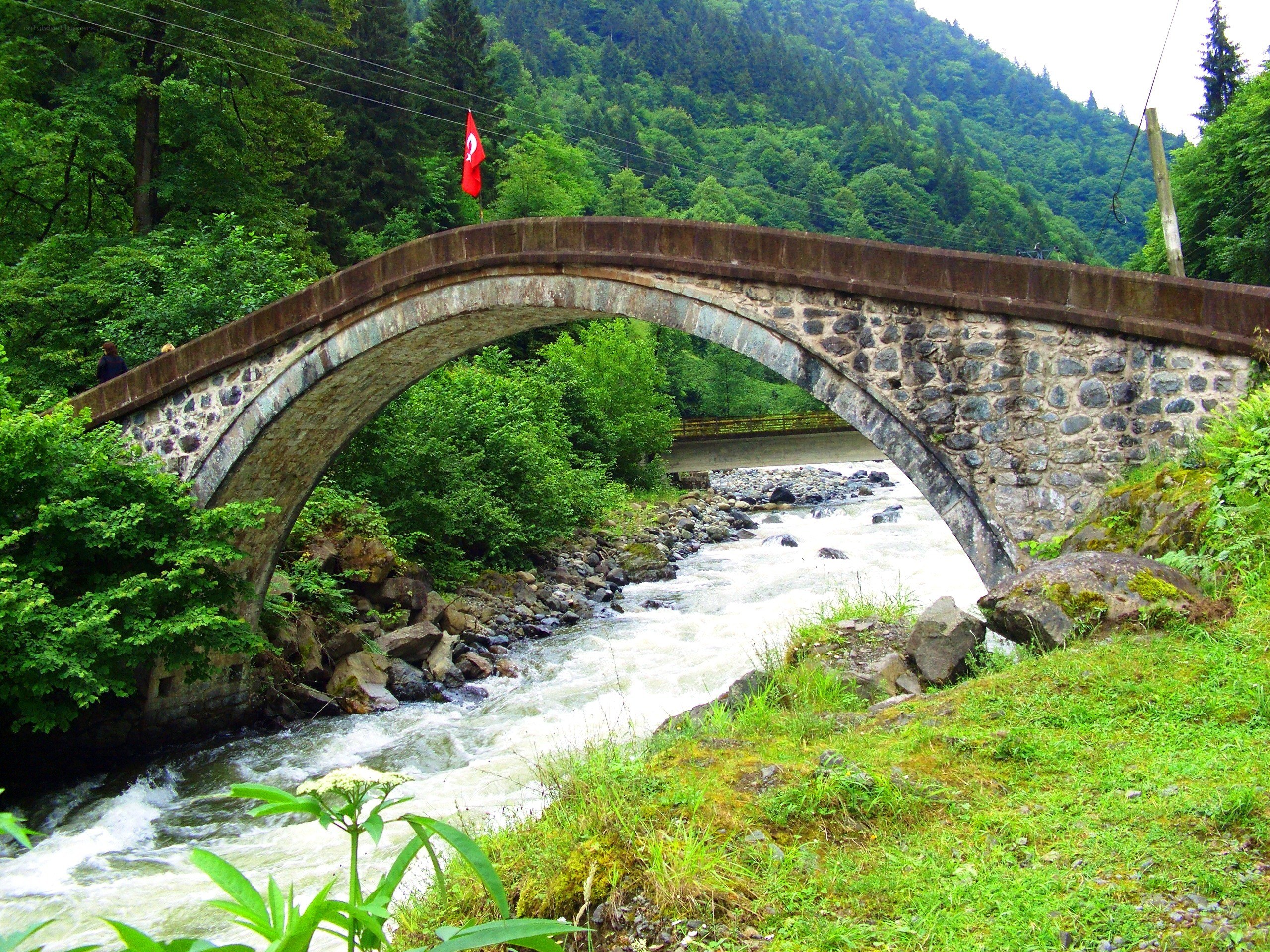 Stone arch bridge over river