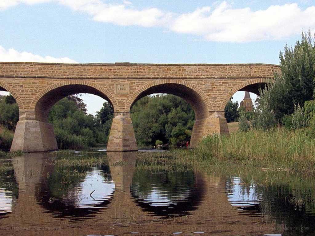 Stone arch bridge over river