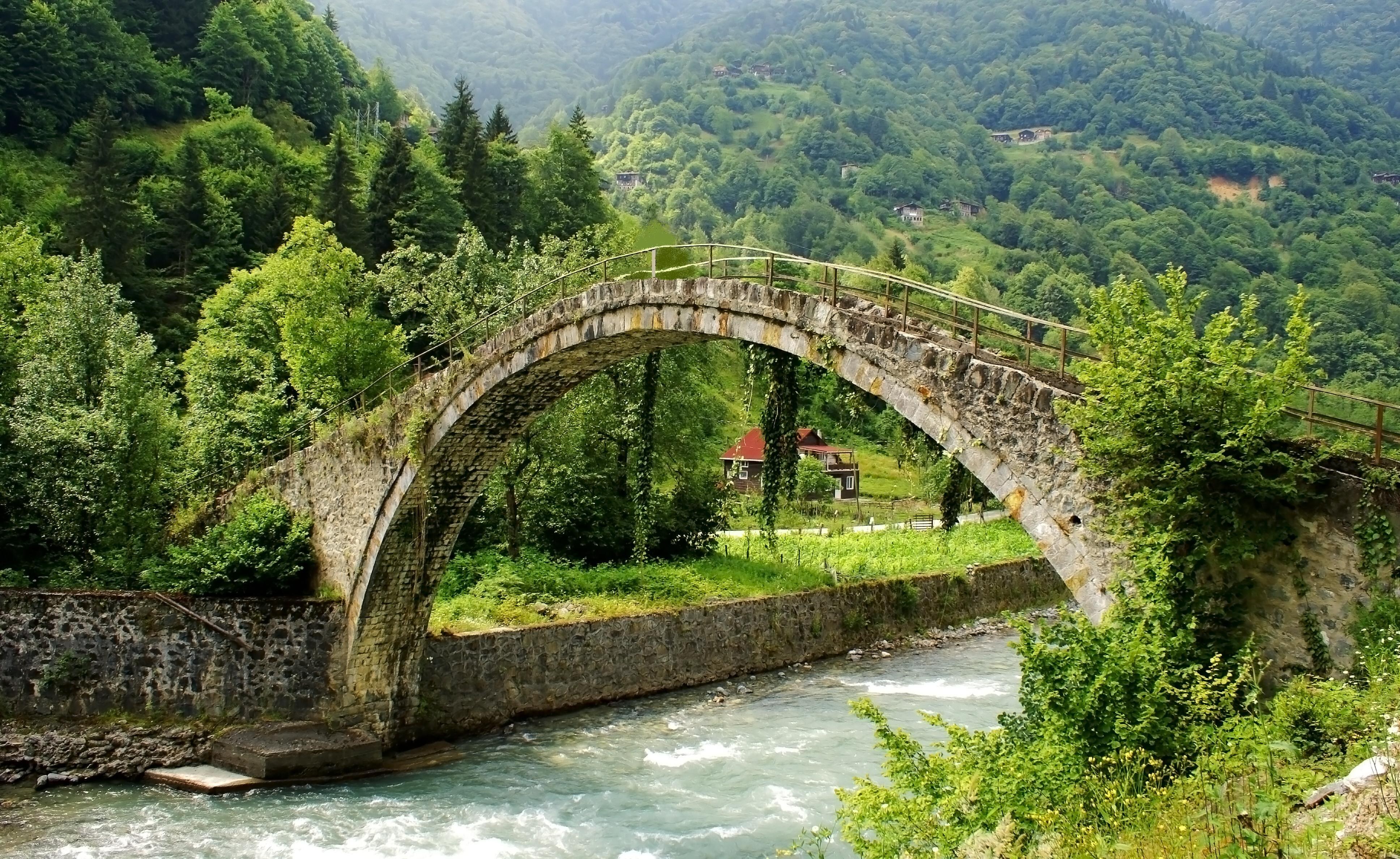 Stone arch bridge over river