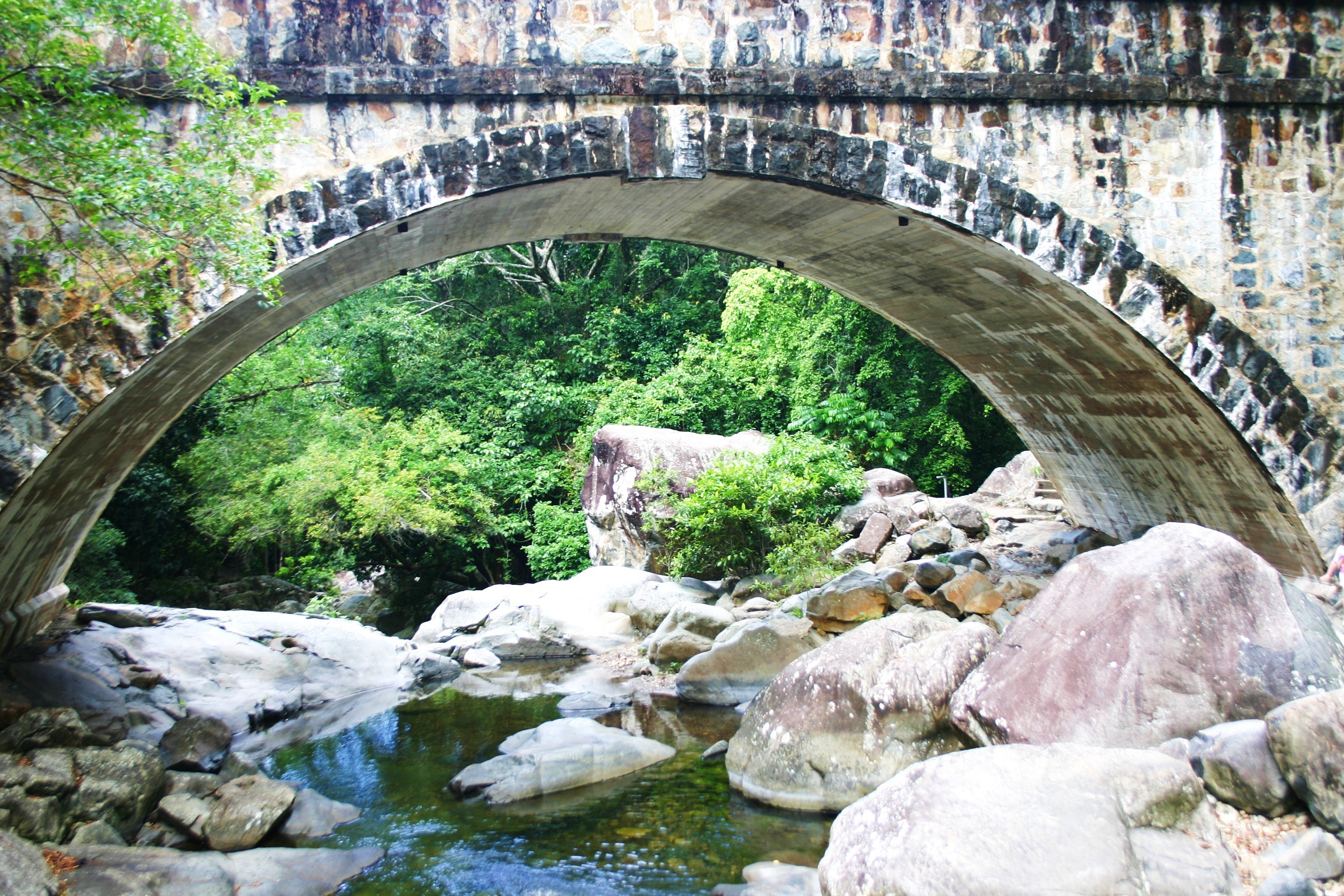 Stone arch bridge over river