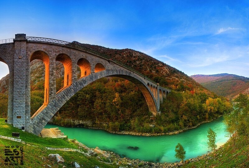 Stone arch bridge over river