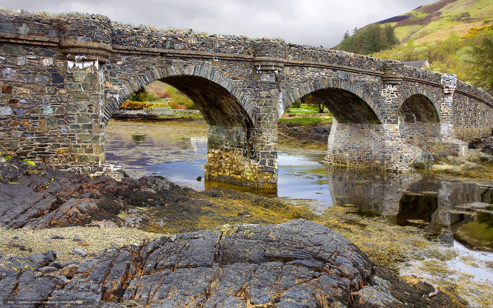 Stone arch bridge over river